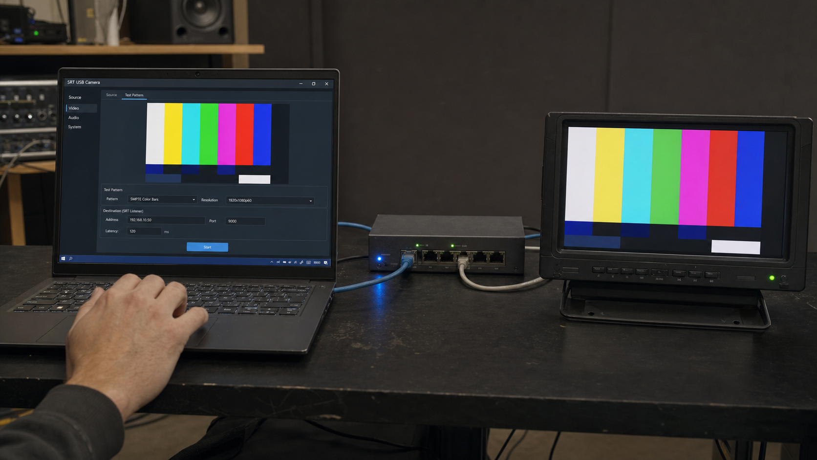 An operator selects a color-bar test signal in SRT USB CAM on a laptop, sends it through a wired network switch, and confirms the same picture on a receiver monitor